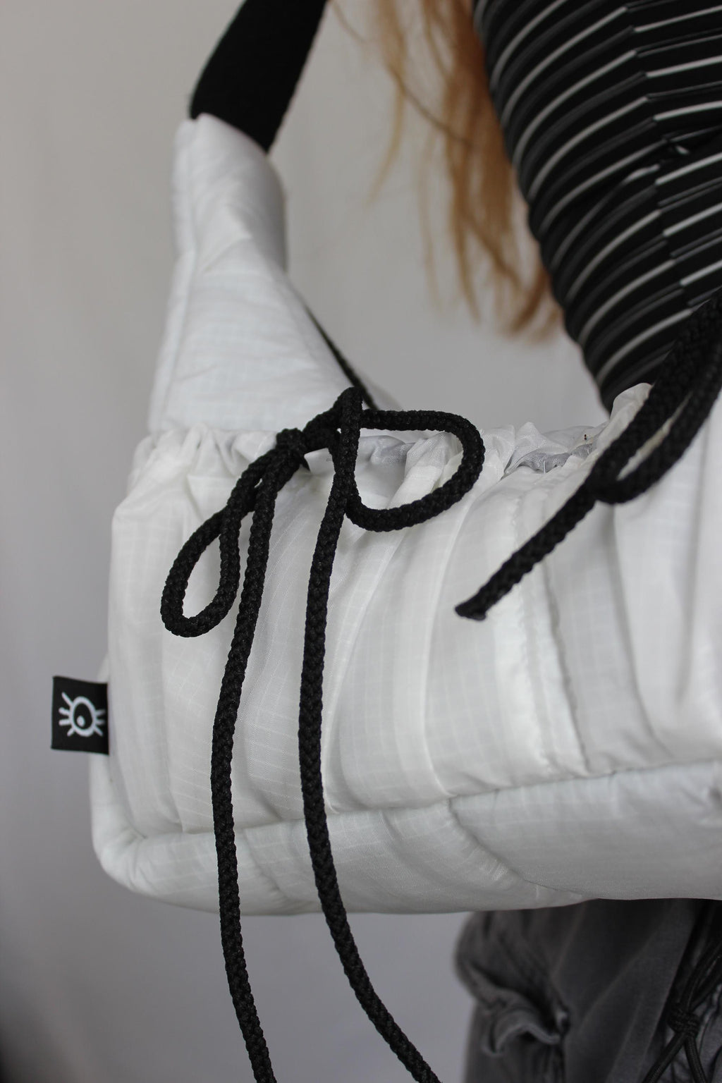 Sustainable hot air balloon offcuts bow shoulder bag with back pocket detail