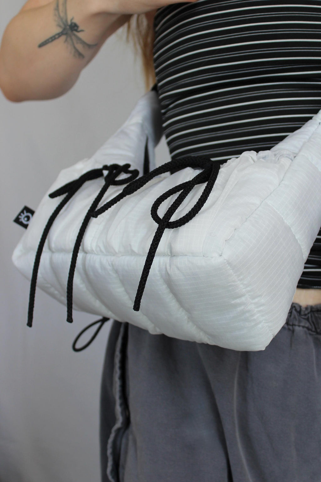 Sustainable hot air balloon offcuts bow shoulder bag with back pocket detail