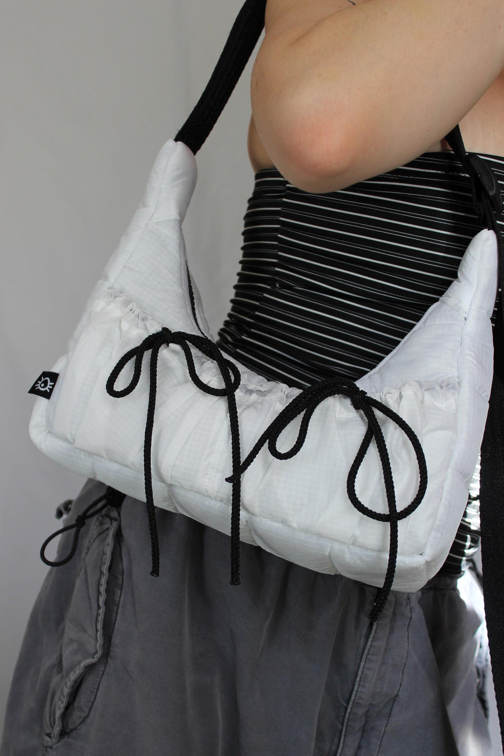 Sustainable hot air balloon offcuts bow shoulder bag with back pocket detail