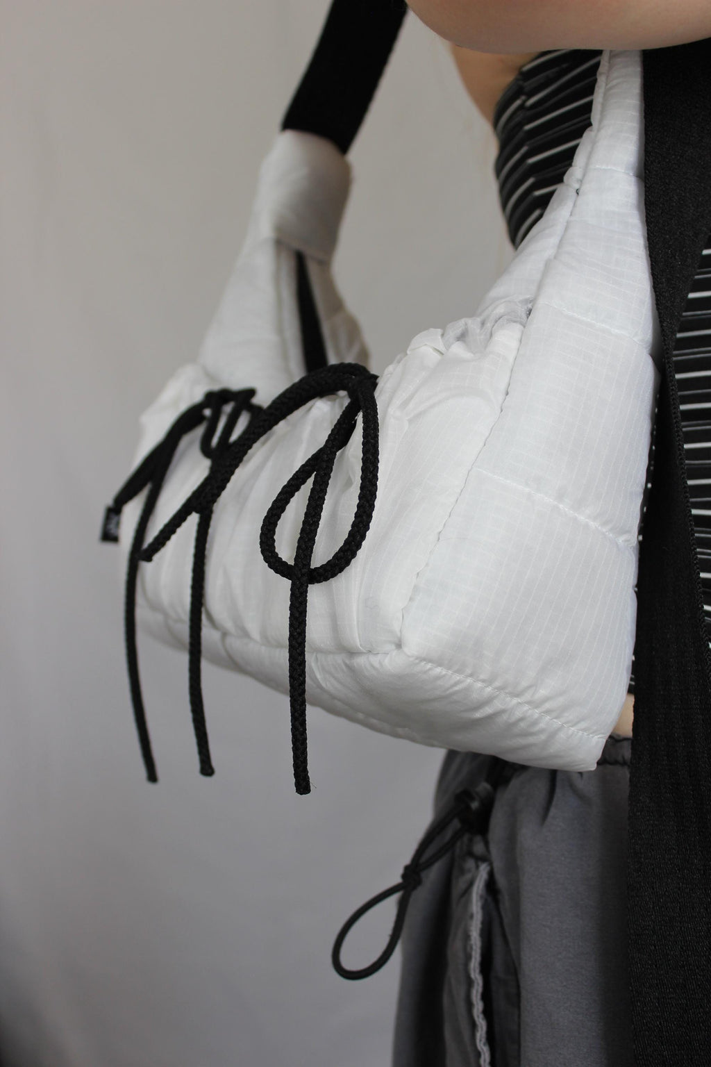 Sustainable hot air balloon offcuts bow shoulder bag with back pocket detail