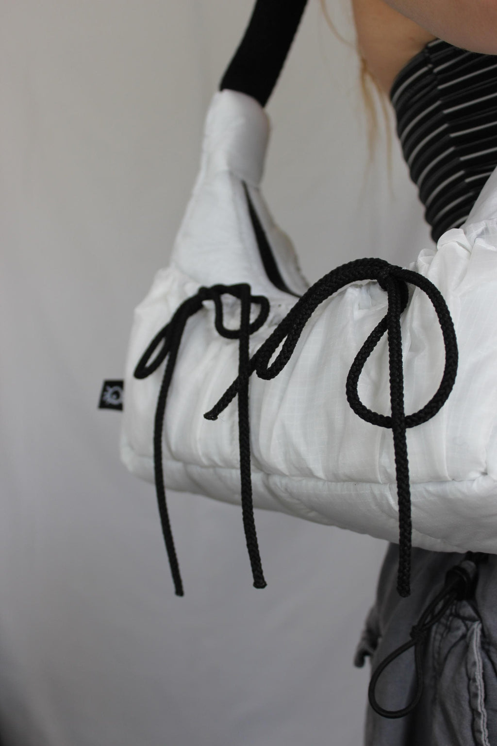 Sustainable hot air balloon offcuts bow shoulder bag with back pocket detail