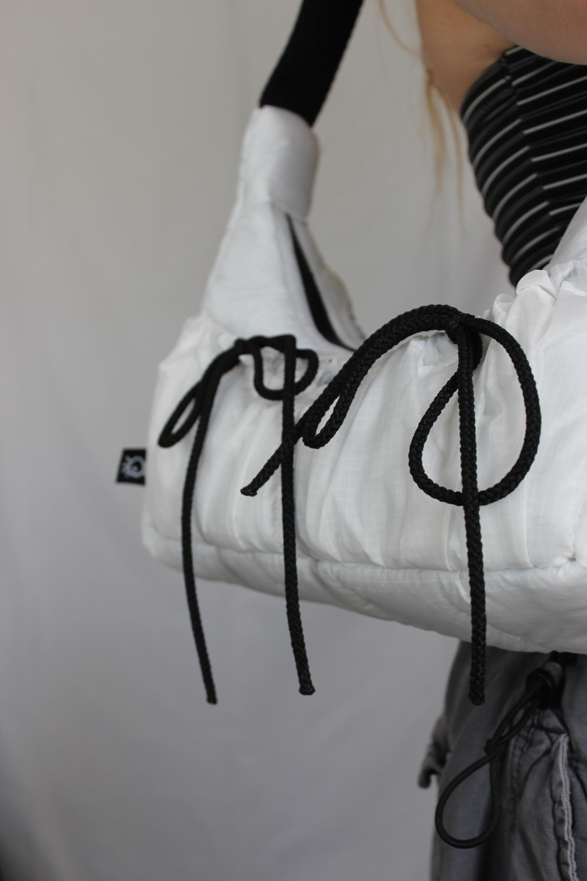 Sustainable hot air balloon offcuts bow shoulder bag with back pocket detail