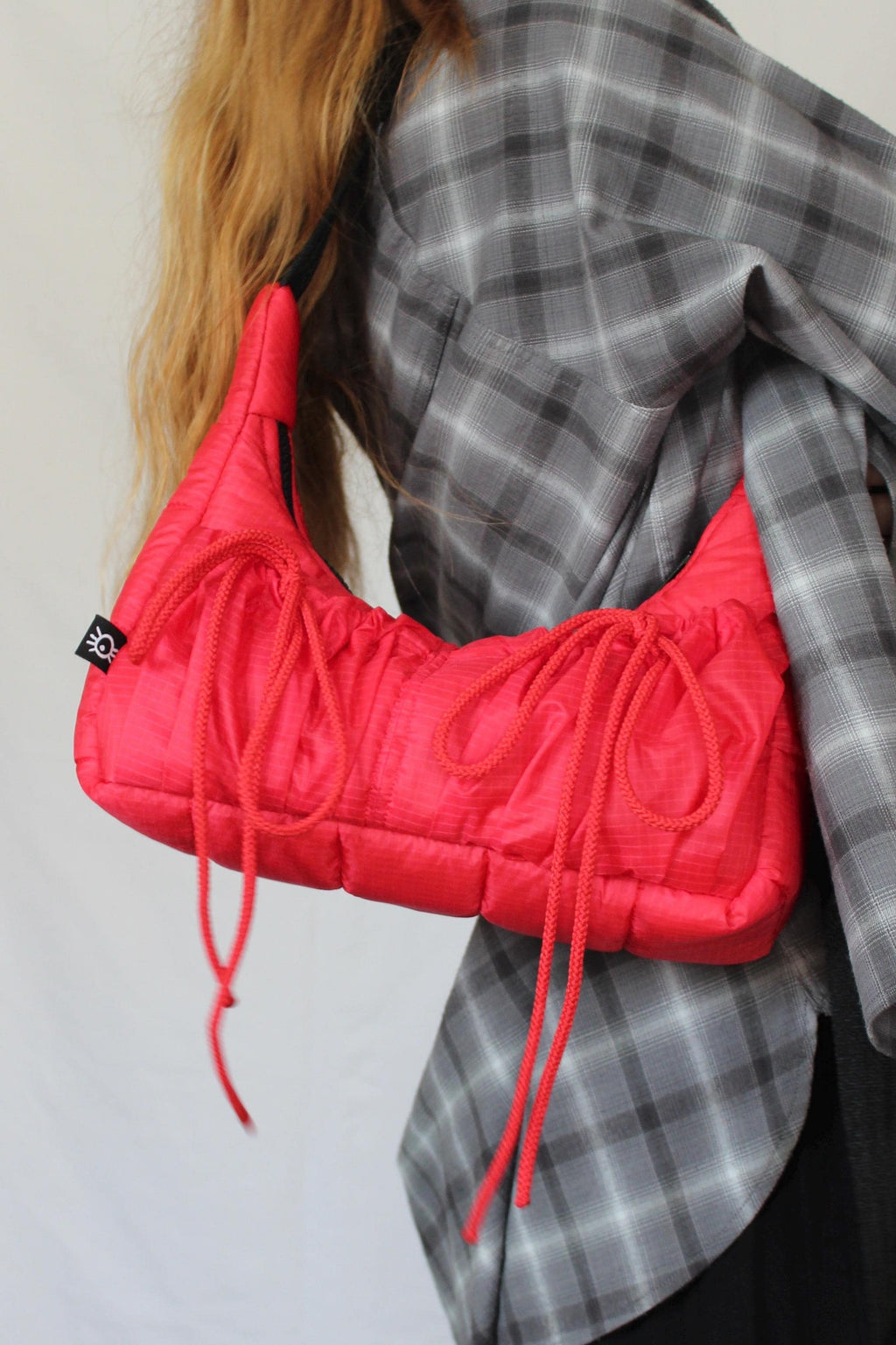 Sustainable hot air balloon offcuts bow shoulder bag with back pocket detail