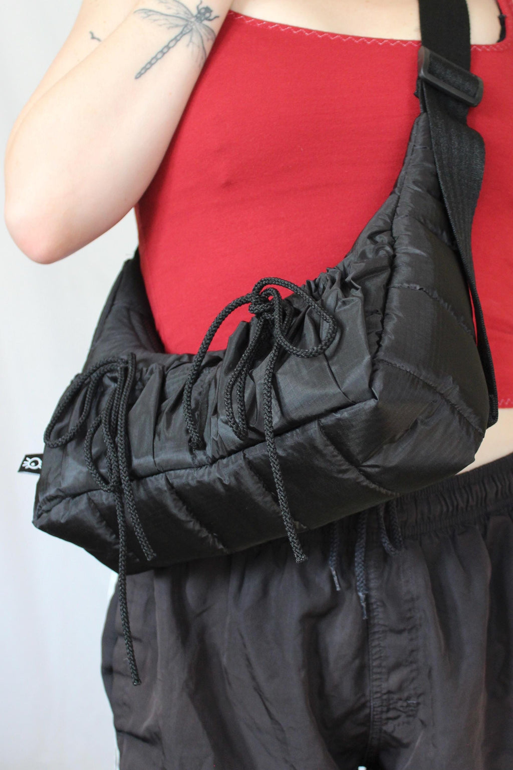 Sustainable hot air balloon offcuts bow shoulder bag with back pocket detail